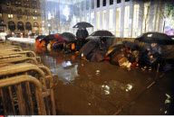 NY: APPLE FANS WAIT IN THE RAIN FOR IPAD 2 RELEASE
