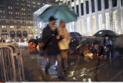 NY: APPLE FANS WAIT IN THE RAIN FOR IPAD 2 RELEASE