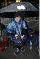NY: APPLE FANS WAIT IN THE RAIN FOR IPAD 2 RELEASE