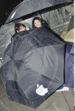 NY: APPLE FANS WAIT IN THE RAIN FOR IPAD 2 RELEASE