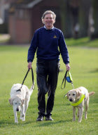 Graham Waspe with his guide dogs Edward and Opal, Stowmarket, Suffolk, Britain - 10 Mar 2011