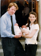 9th Earl Spencer And Countess Spencer With Twins. Father Craddled One Sleepy Baby And Mother Held The Other. The Earl And Countess Spencer Were Introducing Their Twin Daughters To The World Yesterday. Lord Spencer Brother Of Princess Diana Looked Sui