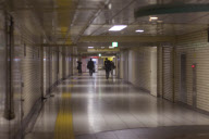 Darkened subway corridors during brownouts to conserve electricity following nuclear accident