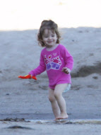 EXCLUSIVE Alyson Hannigan, husband Alexis Denisof and daughter Satyana go to the beach