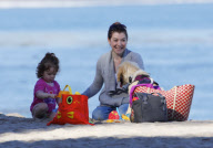 EXCLUSIVE Alyson Hannigan, husband Alexis Denisof and daughter Satyana go to the beach