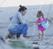 EXCLUSIVE Alyson Hannigan, husband Alexis Denisof and daughter Satyana go to the beach