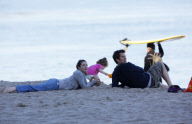 EXCLUSIVE Alyson Hannigan, husband Alexis Denisof and daughter Satyana go to the beach