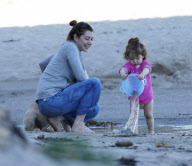 EXCLUSIVE Alyson Hannigan, husband Alexis Denisof and daughter Satyana go to the beach