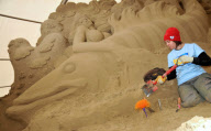 Artists at work at Sandworld indoor sand sculpture park, Weymouth, Dorset, Britain - 06 Apr 2011