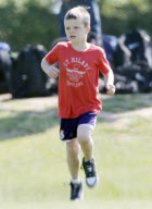 EXCLUSIVE... Pregnant Victoria Beckham Watches Over Her Boys On The Soccer Field
