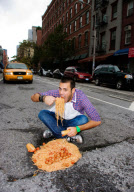 Artists David Luciano and Claudia Ficca turn potholes into works of art, Montreal, Canada - 2009