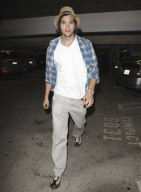 Ashton Kutcher and Demi Moore (hiding her face) leave Arclight Cinemas