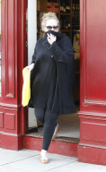 SINGER ADELE GOT CAMERA-SHY WHEN SHE REALIZED SHE WAS BEING PHOTOGRAPHED BUYING SOME BOOZE