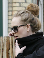 SINGER ADELE GOT CAMERA-SHY WHEN SHE REALIZED SHE WAS BEING PHOTOGRAPHED BUYING SOME BOOZE
