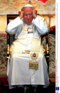 POPE JOHN PAUL II IN ISRAEL - Yasser Arafat saluting next to Pope John Paul II during a welcoming ceremony for the pontiff in the biblical town of Bethlehem as Palestinian troops march by