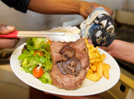 Beefeater Grill puts its own stamp on the Royal Wedding by serving customers with a royal rump steak of the happy couple-London, United Kingdom.