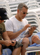 Adam Shankman on the beach with his iPad