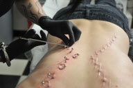 Corset piercing craze sees ribbon 'sewn' onto backs, ribs and thoroats, Southampton, Hampshire, Britain - 3 May 2011