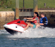 Russell Brand on a wave runner