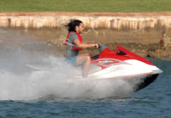 Russell Brand on a wave runner