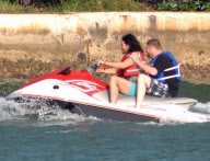 Russell Brand on a wave runner