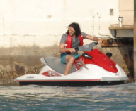 Russell Brand on a wave runner