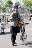 LIEV SCHRIBER AND SON ALEXANDER SPEND THE AFTERNOON TOGETHER BIKING AND PLAYING.