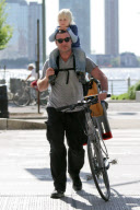 LIEV SCHRIBER AND SON ALEXANDER SPEND THE AFTERNOON TOGETHER BIKING AND PLAYING.