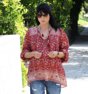 Pregnant Selma Blair takes a stroll and stops to smell the flowers