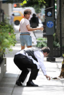 SACHA BARON COHEN AKA BORAT GRABS SOME FOOD FROM A TABLE OF UNSUSPECTING DINERS AND IS BEING CHASED BY A WAITER WHILE FILMING "THE DICTATOR: IN NEW YORK