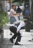 SACHA BARON COHEN AKA BORAT GRABS SOME FOOD FROM A TABLE OF UNSUSPECTING DINERS AND IS BEING CHASED BY A WAITER WHILE FILMING "THE DICTATOR: IN NEW YORK