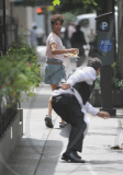 SACHA BARON COHEN AKA BORAT GRABS SOME FOOD FROM A TABLE OF UNSUSPECTING DINERS AND IS BEING CHASED BY A WAITER WHILE FILMING "THE DICTATOR: IN NEW YORK