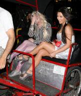 Kim Kardashian and a friend riding a pedicab in NYC