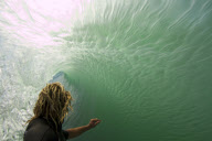 Surfer takes photgraphs inside wave roll, Australia - 2010