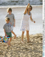 Actress JODIE FOSTER flies a kite with her adopted sons on a Maui beach