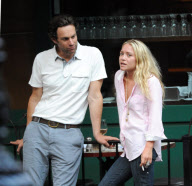 MARY KATE OLSEN WITH A MALE FRIEND SMOKING AND DRINKING OUTSIDE A RESTAURANT IN THE WEST VILLAGE  NEW YORK