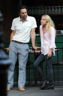 MARY KATE OLSEN WITH A MALE FRIEND SMOKING AND DRINKING OUTSIDE A RESTAURANT IN THE WEST VILLAGE  NEW YORK