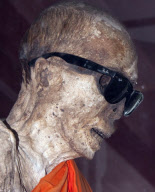 Mummified monk wearing Ray Ban sunglasses at a shrine in Koh Samui, Thailand - 15 Jul 2011