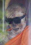 Mummified monk wearing Ray Ban sunglasses at a shrine in Koh Samui, Thailand - 15 Jul 2011