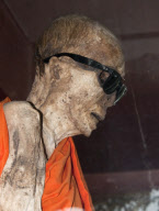 Mummified monk wearing Ray Ban sunglasses at a shrine in Koh Samui, Thailand - 15 Jul 2011