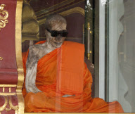 Mummified monk wearing Ray Ban sunglasses at a shrine in Koh Samui, Thailand - 15 Jul 2011