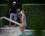 Fresh faced and makeup free 'Dancing with the stars' Julianne Hough takes a quick dip in the ocean before heading poolside to meet up with her boyfriend Ryan Seacrest 