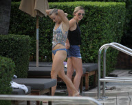 Fresh faced and makeup free 'Dancing with the stars' Julianne Hough takes a quick dip in the ocean before heading poolside to meet up with her boyfriend Ryan Seacrest 