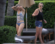 Fresh faced and makeup free 'Dancing with the stars' Julianne Hough takes a quick dip in the ocean before heading poolside to meet up with her boyfriend Ryan Seacrest 