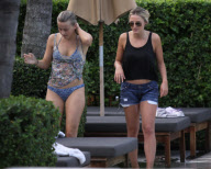 Fresh faced and makeup free 'Dancing with the stars' Julianne Hough takes a quick dip in the ocean before heading poolside to meet up with her boyfriend Ryan Seacrest 