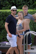 Julianne Hough and Ryan Seacrest relax poolside in South Beach