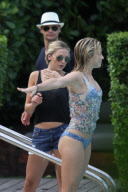 Julianne Hough and Ryan Seacrest relax poolside in South Beach