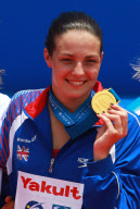 GB Swimmer Keri-Anne Payne wins gold medal in the 10k open water event at the Fina World Championships in Shanghai to seal her spot at the 2012 Olympics