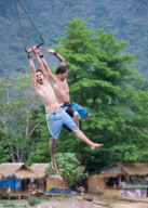 Backpackers Tubing on the Nam Song river in Vang Vieng, Laos - Mar 2011