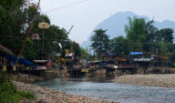Backpackers Tubing on the Nam Song river in Vang Vieng, Laos - Mar 2011